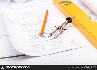 Tools and papers with sketches on the table