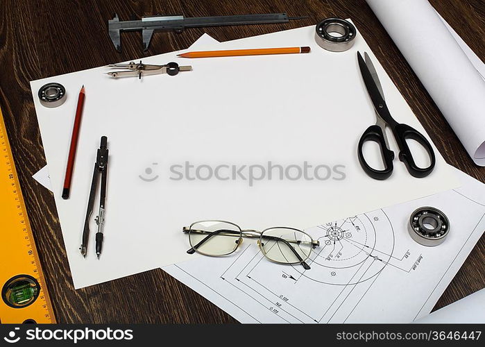 Tools and papers with sketches on the table