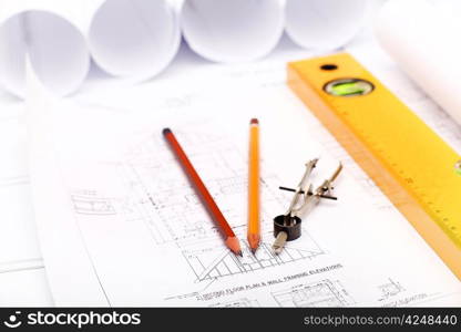 Tools and papers with sketches on the table