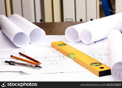 Tools and papers with sketches on the table