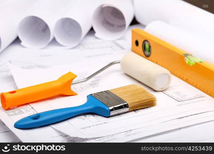 Tools and papers with sketches on the table