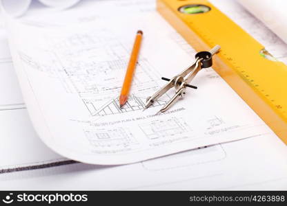 Tools and papers with sketches on the table