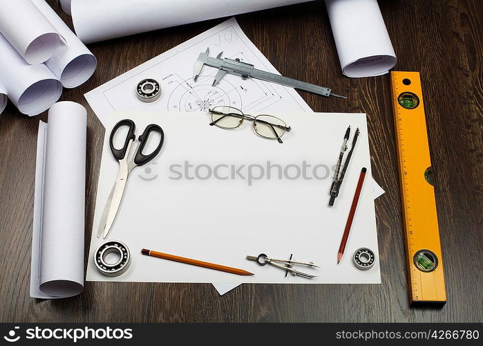 Tools and papers with sketches on the table