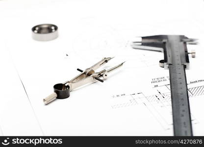 Tools and papers with sketches on the table