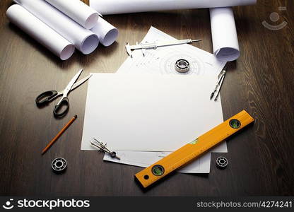 Tools and papers with sketches on the table