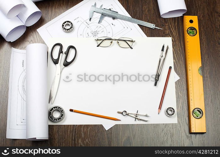 Tools and papers with sketches on the table