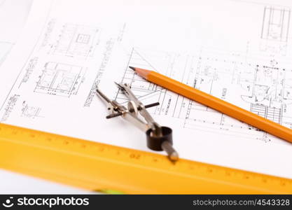 Tools and papers with sketches on the table