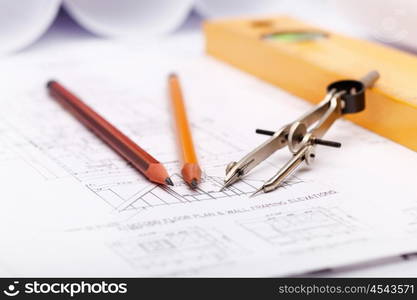 Tools and papers with sketches on the table