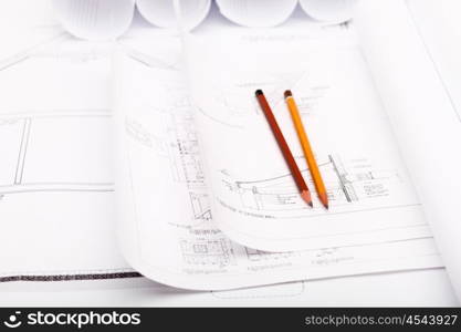 Tools and papers with sketches on the table