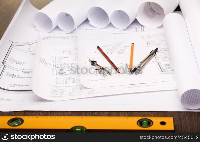 Tools and papers with sketches on the table