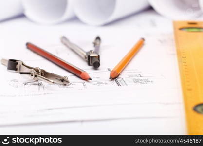 Tools and papers with sketches on the table