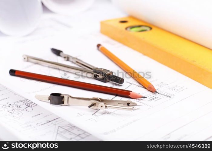 Tools and papers with sketches on the table