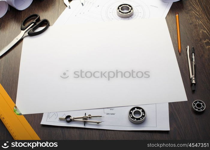 Tools and papers with sketches on the table