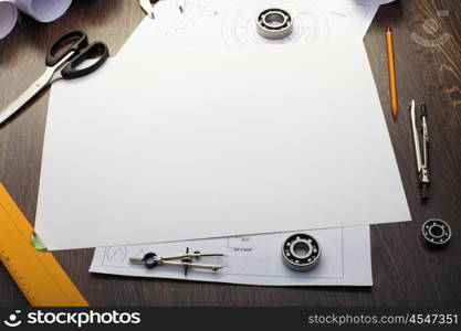 Tools and papers with sketches on the table