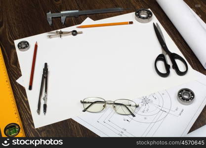 Tools and papers with sketches on the table