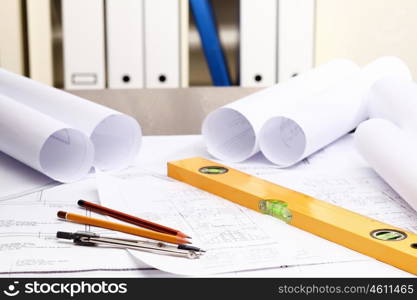 Tools and papers with sketches on the table