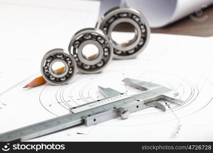 Tools and papers with sketches on the table