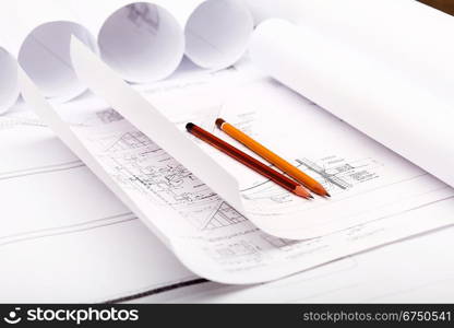 Tools and papers with sketches on the table