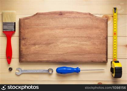 tools at plank wooden board table background texture
