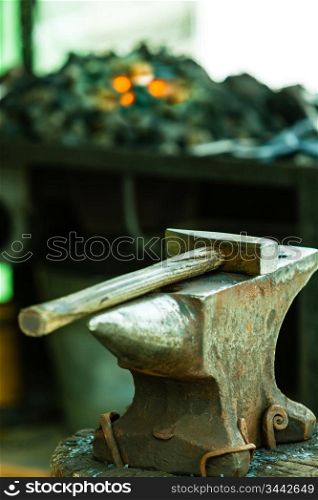 Tools - hammer and anvil used by a blacksmith in old shop