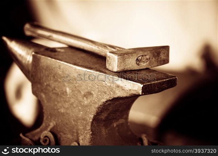 Tools - hammer and anvil used by a blacksmith in old shop