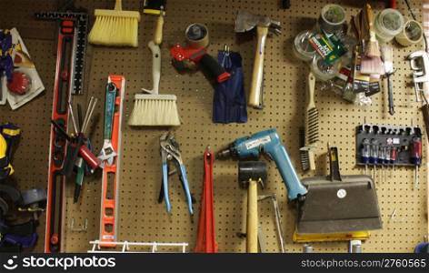 Tools hung on a peg board in the workshop