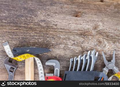 tools kit border on wooden background with copy space
