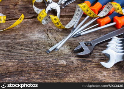 tools kit frame on wooden background with copy space