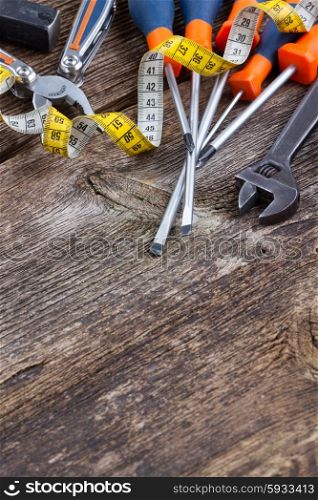 tools kit on aged wooden background with copy space