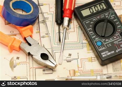 Tools on a background of the electric scheme
