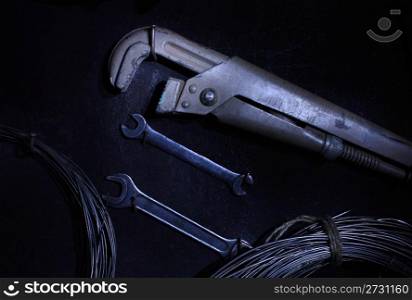 Tools on a black background, light brush