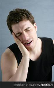 toothache headache pain gesture young man portrait