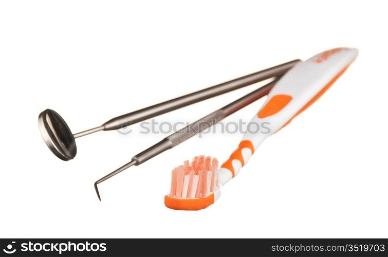 toothbrush and dental Instruments isolated on a white background