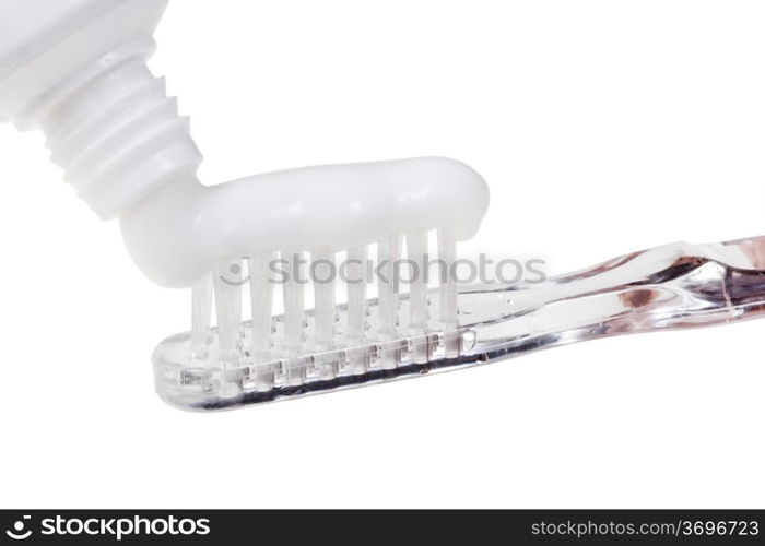 toothbrush and squeezed paste from tube close up isolated on white background