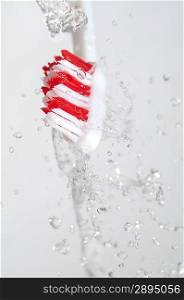 Toothbrush in a water splash