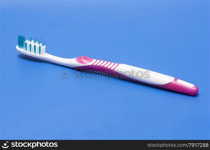 toothbrush isolated on blue background