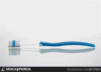 Toothbrush lying on glass shelf