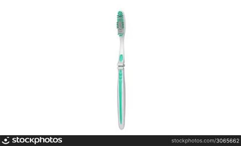 Toothbrush rotates on white background