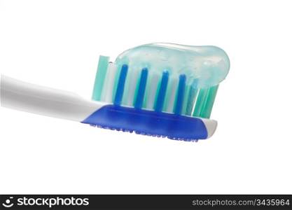 toothbrush with toothpaste isolated on a white background