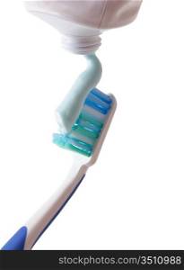 toothbrush with toothpaste squeezed out isolated