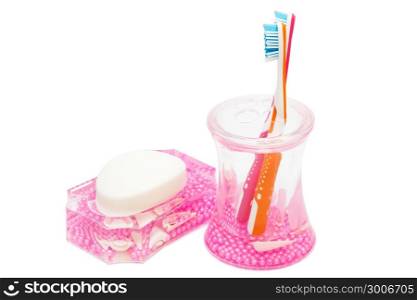 toothbrushes and soap on a white background