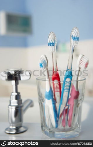 Toothbrushes in bathroom