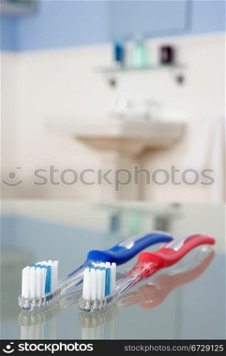 Toothbrushes in bathroom