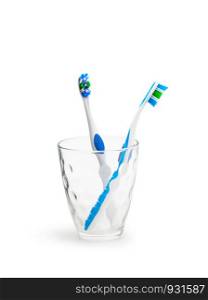 Toothbrushes in glass isolated on white background. With clipping path