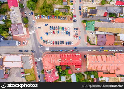 Top aerial panoramic view of Lowicz old town historical city centre with Rynek Market Square, Old Town Hall, New City Hall, colorful buildings with multicolored facade and tiled roofs, Poland