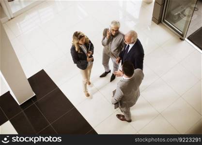 Top angle view at businesspeople colleague team at lobby in office building