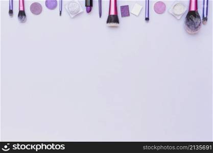 top border arranged with cosmetics product white background