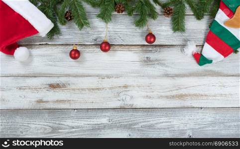 Top border of Christmas decorations on rustic wood