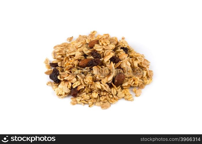 Top close view of a dry mix of fruit and almon nuts cereal on white