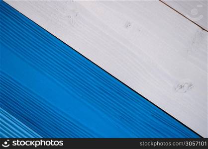 Top diagonal view of blue and white wooden textured background backdrop. Abstract wallpaper pastel blue ocean color